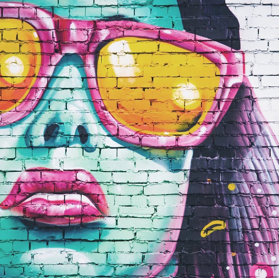 mural of woman's face wearing sunglasses